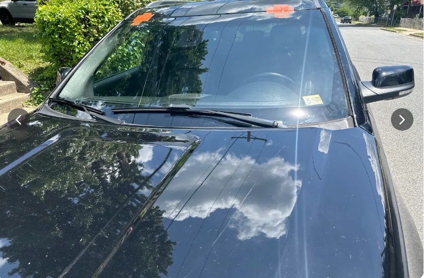 Windshield replacement being performed on a customer's vehicle in their driveway